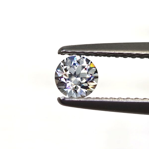 GIA Certified Near Colorless Benitoite Gemstone 0.40 CT.  Round Brilliant Cut